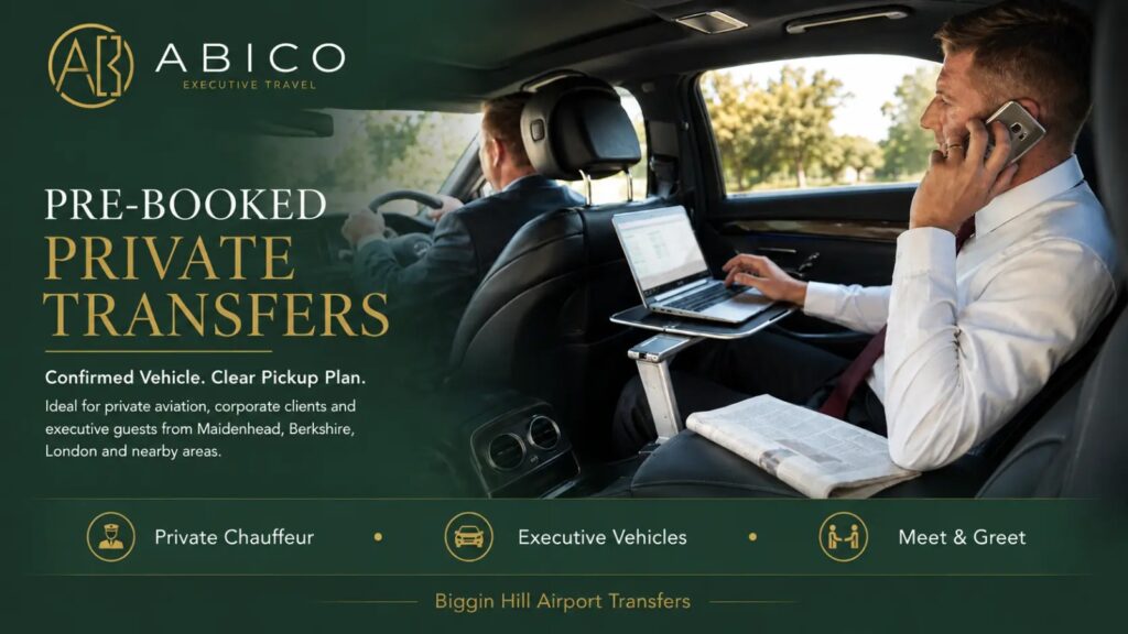Business passenger in premium vehicle working on laptop while calling, showing executive transfer comfort.